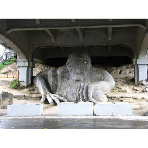 The Fremont Troll was built under the Aurora Bridge in an attempt to make better use of the empty space. Encouraged by the local folklore of trolls that live under bridges and terrorize children and luminous women, the Fremont Arts Council held a national contest to find the most creative design for a troll monument. In 1990, the 18-foot monument was built using more than two tons of concrete, rebar and wire   oh, and a 1960s Volkswagen Beetle. Over the last couple of decades, shops and local entertainment have developed around the Troll, including Troll-a-ween and the performance of Shakespeare at the Troll. At one time, the Elvis time capsule was imbedded inside. There is enough room under the bridge to pull over and snap a photo or two, so don t forget to bring along your camera.