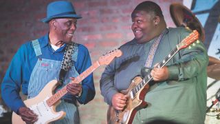 Christone 'Kingfish' Ingram plays guitar with blues legend Buddy Guy