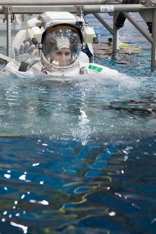 Astronauts Submerging in Waters of Neutral Buoyancy Laboratory