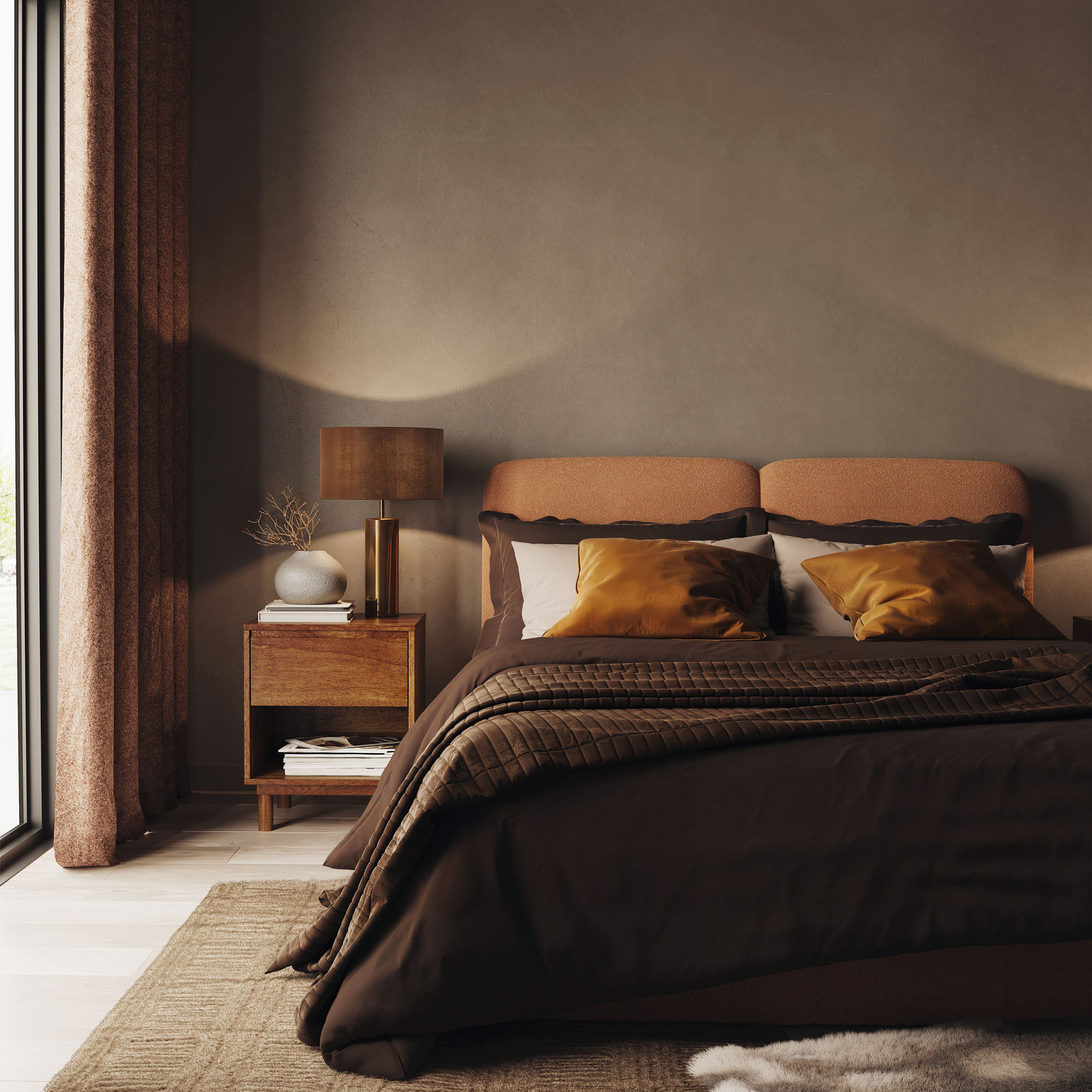 Brown bedroom with layered brown bedding and large tan rug.