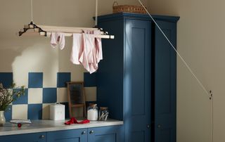utility room with drying rack suspended from ceiling