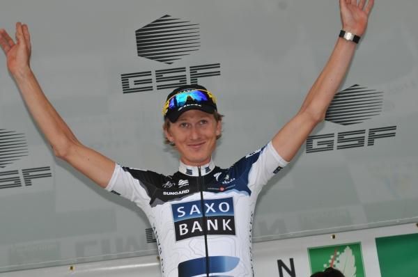 Gustav Larsson on stage to receive his yellow jersey.