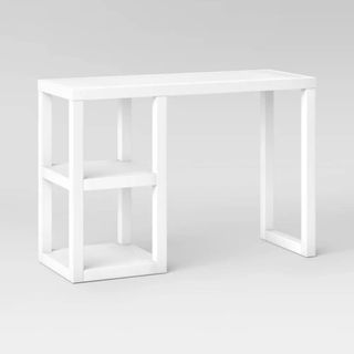 A white desk with extra storage shelves