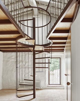 Room with designed spiral stairway