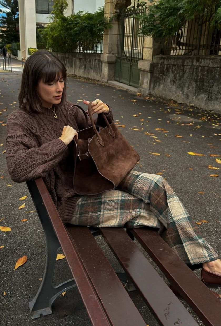 @juliesfi wears a suede bowling bag