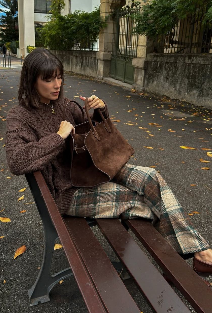 @juliesfi wears a suede bowling bag