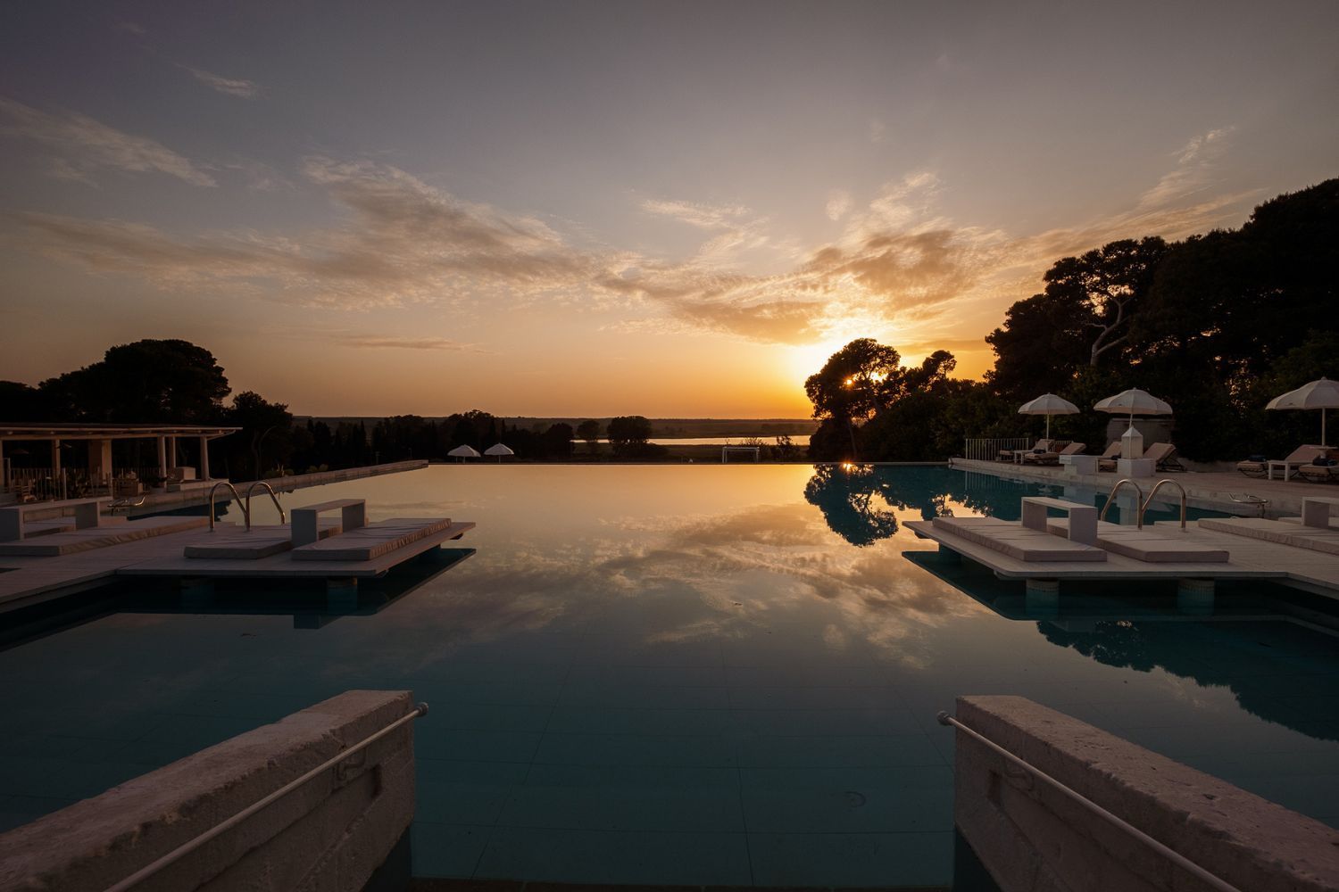 Baglioni Masseria Muzza pool as the sun sets