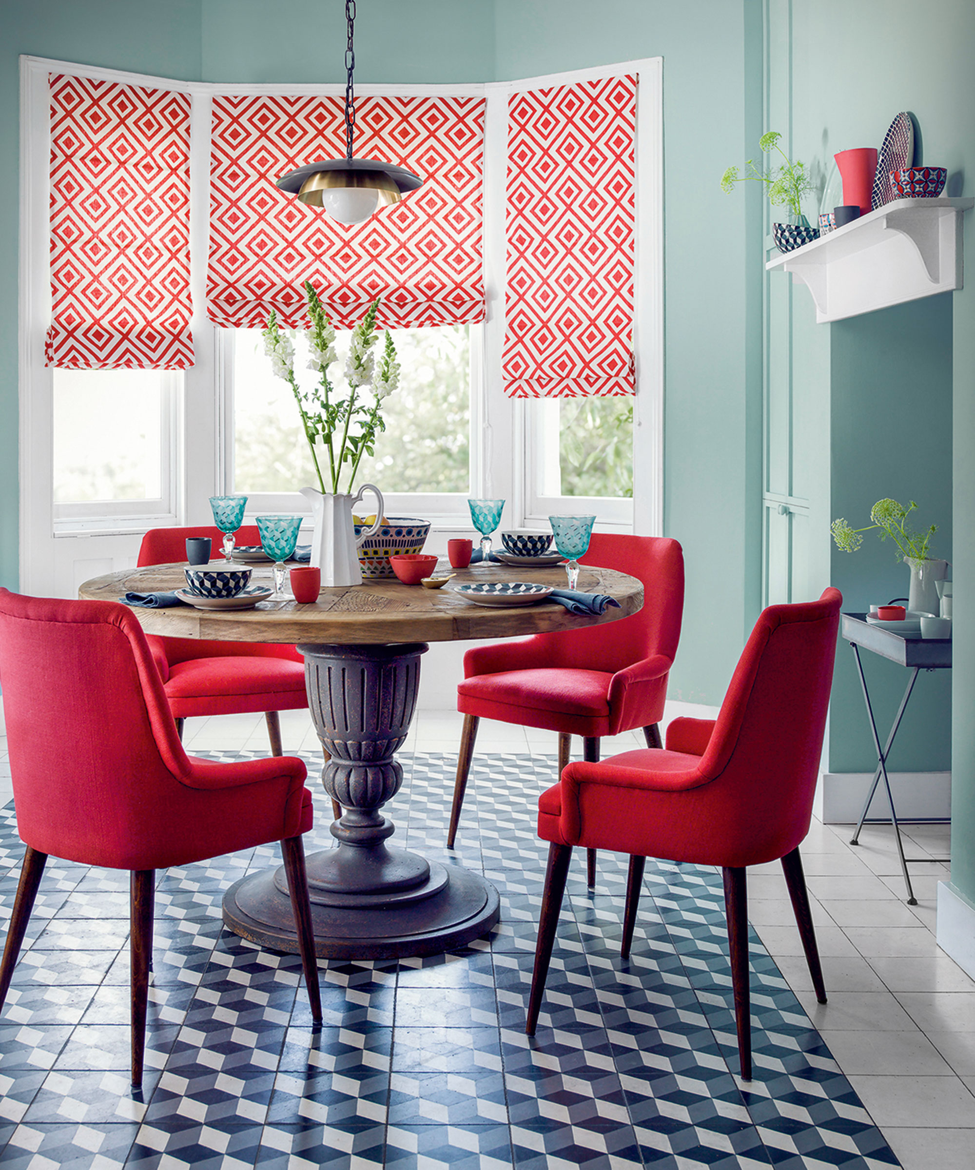 Dining room ideas with red chairs and teal walls