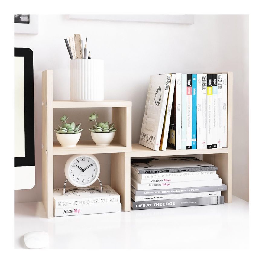 light wood desk organizer with books, clock and cacti