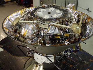 NASA's InSight Mars lander is seen inside the back shell of its protective aeroshell during spacecraft assembly in July 2015.