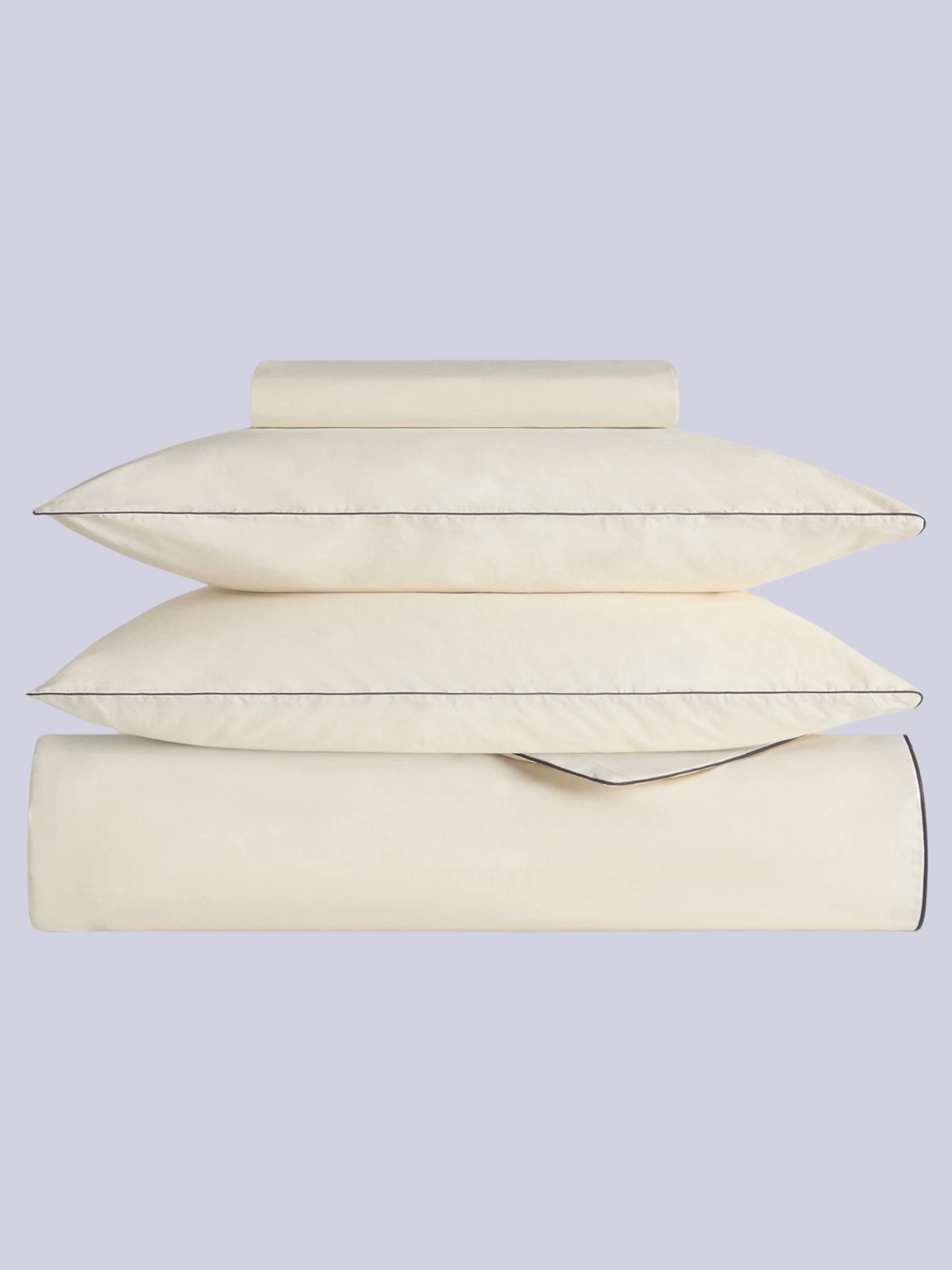 A buttermilk cooling duvet set with navy piping from Rise &amp;amp; Fall