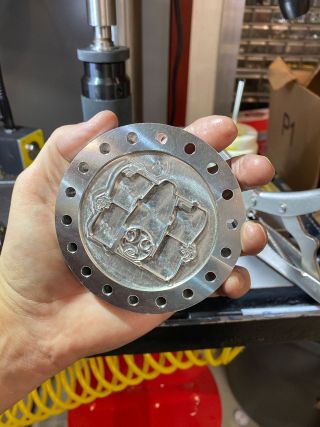 The custom die for Richard Garriott's hydroforming experiment features the outline of the "Limiting Factor," the submersible for the Challenger Deep expedition.