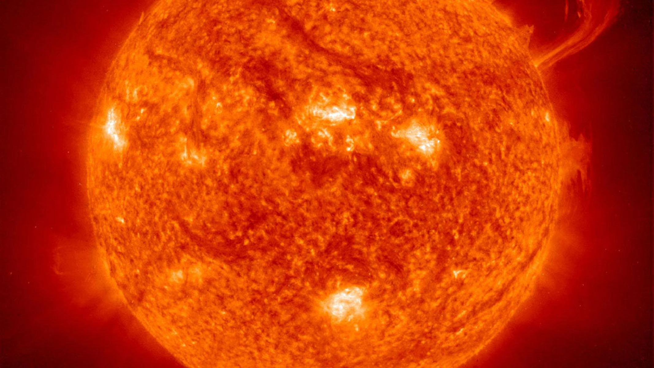 A close up of the sun with a solar flare present on the right of the solar disk.