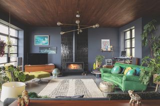 black living room with tiles fireplace for stove