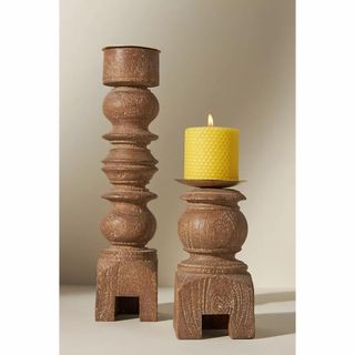 A pair of wooden pillar candle holders