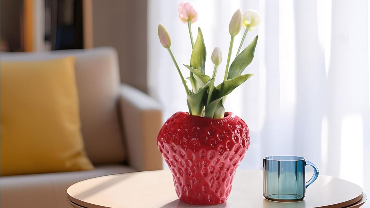 Strawberry vase on table in living room