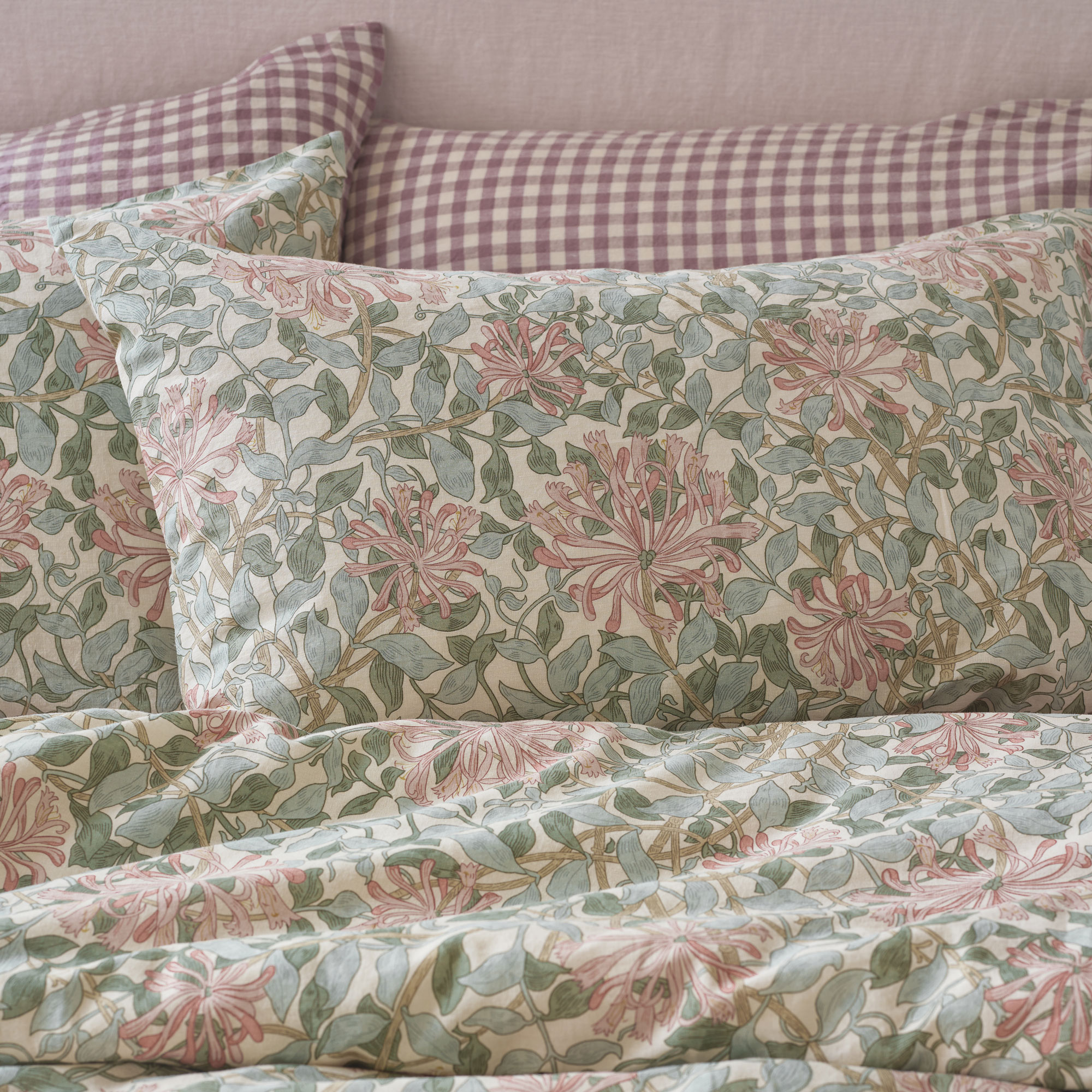 Piglet in Bed Morris and Co bedding in green with red headboard