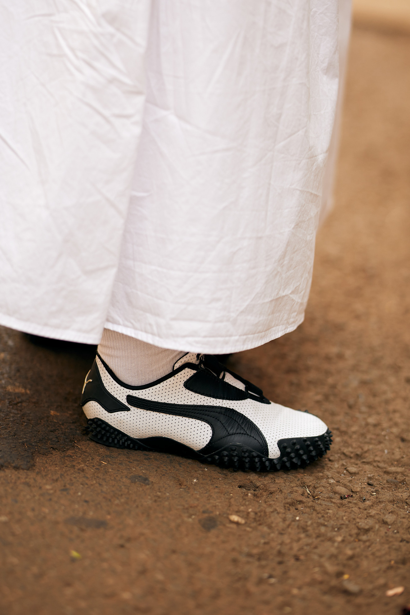 woman wearing puma sneakers