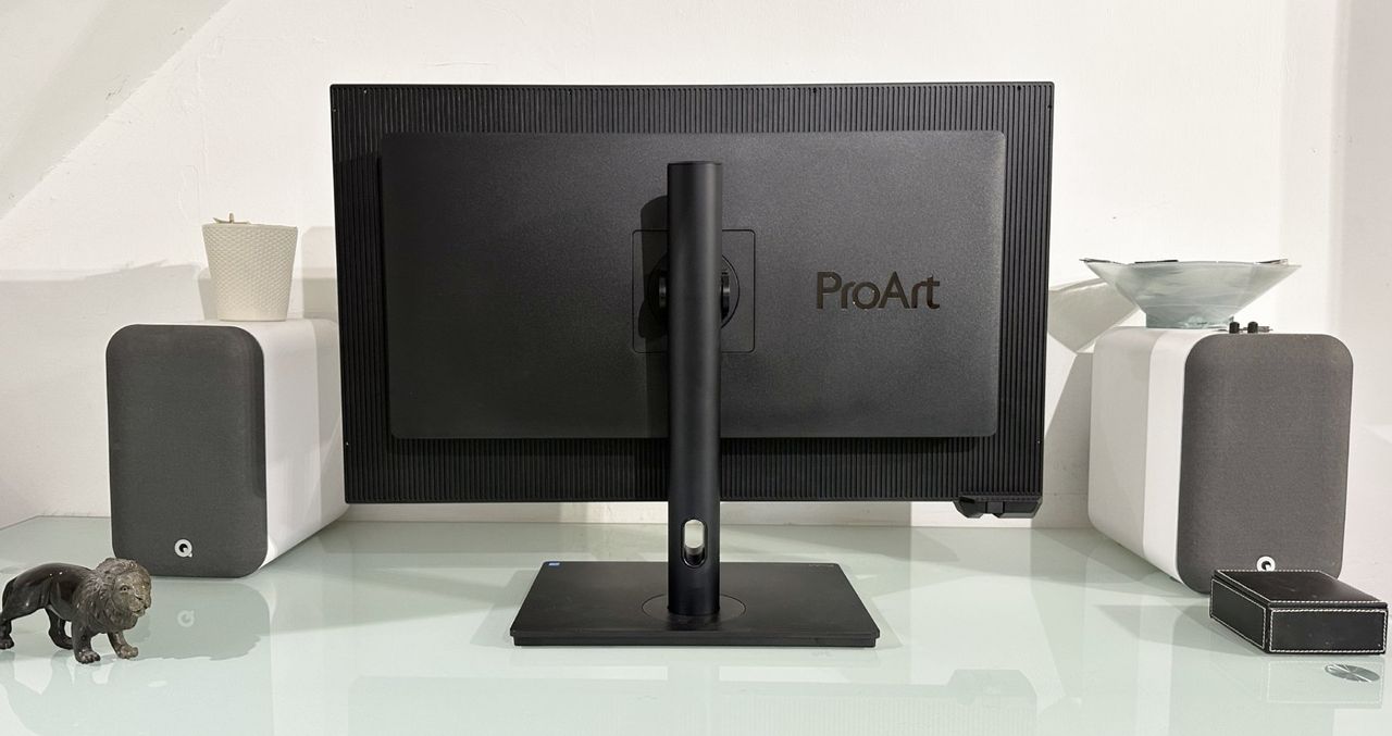The Asus ProArt PA32KCX 8K monitor on a white desk in a home office during our review process