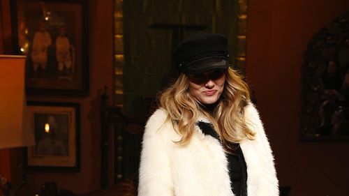 Textile, Outerwear, Hat, Fur clothing, Fashion, Knee, Fur, Natural material, Street fashion, Houseplant,