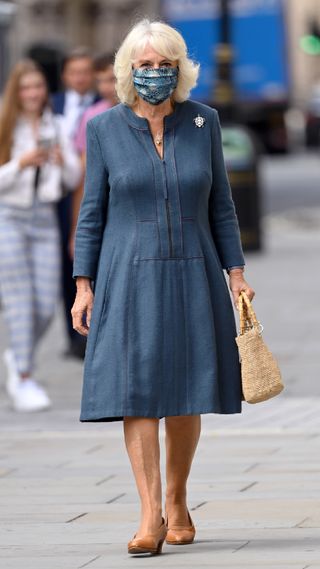 Queen Camilla in a classic navy dress