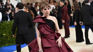 Lena Dunham wears an Elizabeth Kennedy gown on the red carpet.