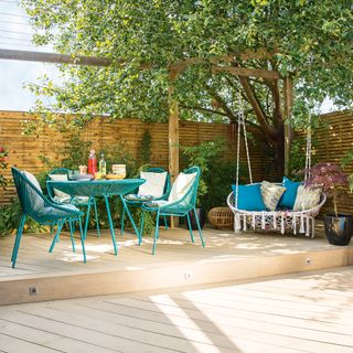 Decking area with blue and pink outdoor seating
