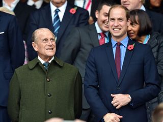 Prince William smiles with his grandfather Prince Philip