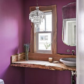 washroom with purple wall and wooden platform