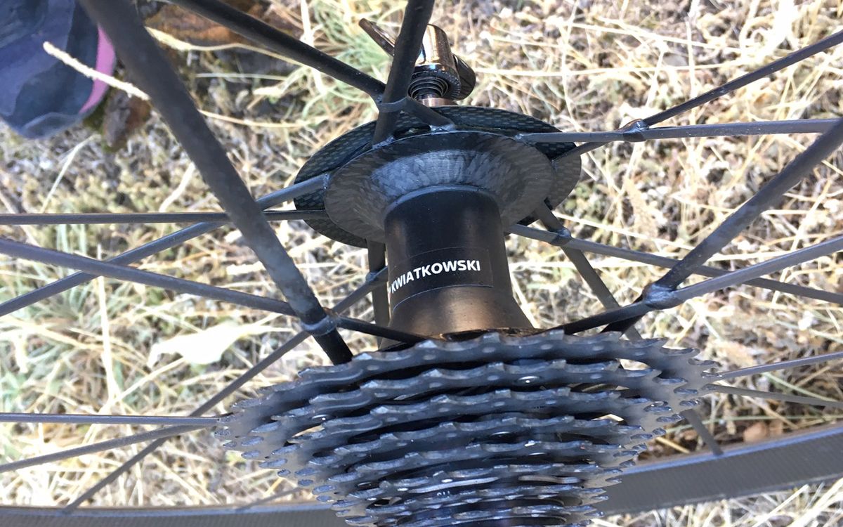 The wheels feature a predominantly carbon construction, including bonded carbon spokes