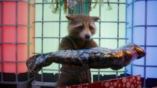 Rocket Raccoon holding Bucky Barnes' metal arm in The Guardians of the Galaxy Holiday Special