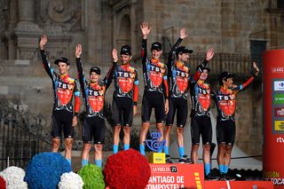 SANTIAGO DE COMPOSTELA SPAIN SEPTEMBER 05 Yukiya Arashiro of Japan Damiano Caruso of Italy Jack Haig of Australia Gino Mder of Switzerland Mark Padun of Ukraine Wouter Poels of Netherlands Jan Tratnik of Slovenia and Team Bahrain Victorious celebrates winning the best team on the podium ceremony in the Plaza del Obradoiro with the Cathedral in the background after the 76th Tour of Spain 2021 Stage 21 a 338 km Individual Time Trial stage from Padrn to Santiago de Compostela lavuelta LaVuelta21 ITT on September 05 2021 in Santiago de Compostela Spain Photo by Stuart FranklinGetty Images