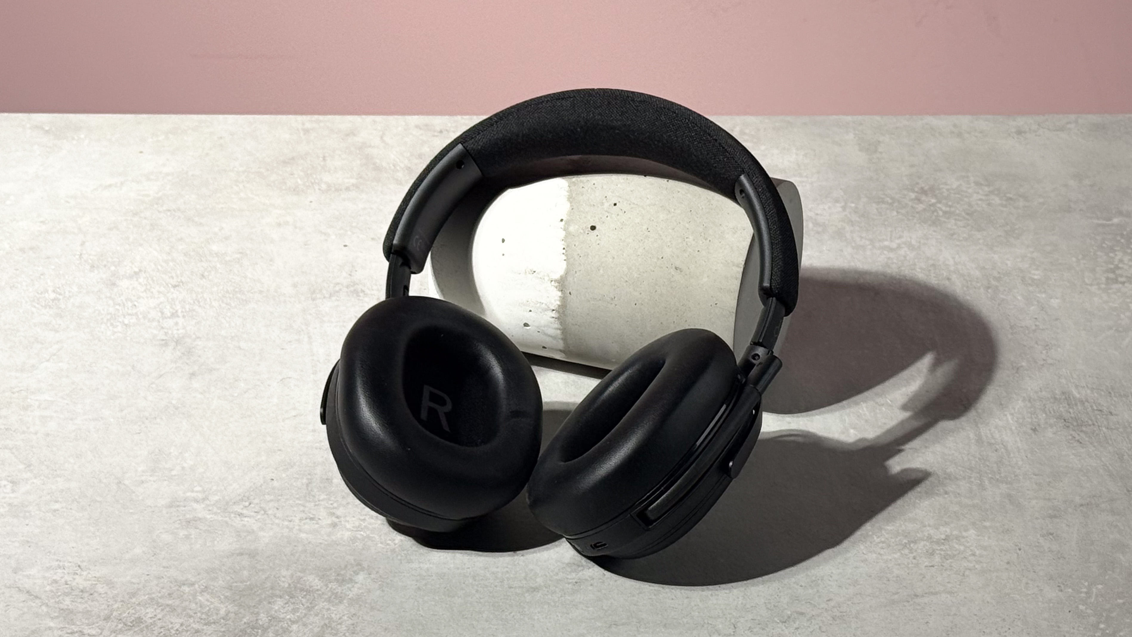 The Final VR3000 EX for Gaming open and leant against a stone and concrete cylinder on its side.
