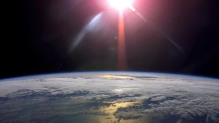 A rising sun and Earth's horizon are featured in this image photographed by an Expedition 13 crewmember on the International Space Station.