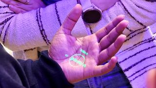 Humane AI Pin laser UI being projected onto a person's hand