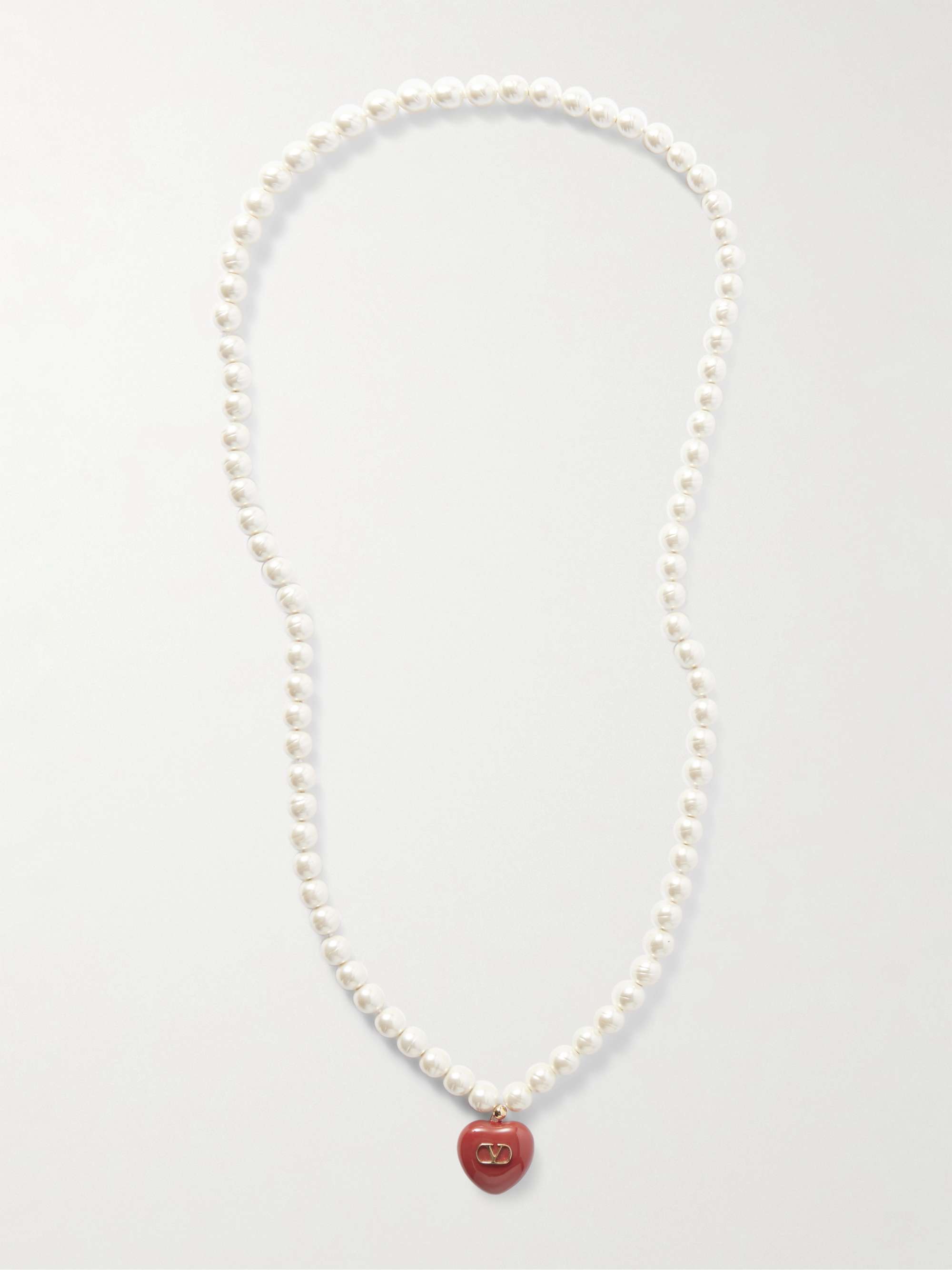 Golden, artificial pearls and enamel necklaces