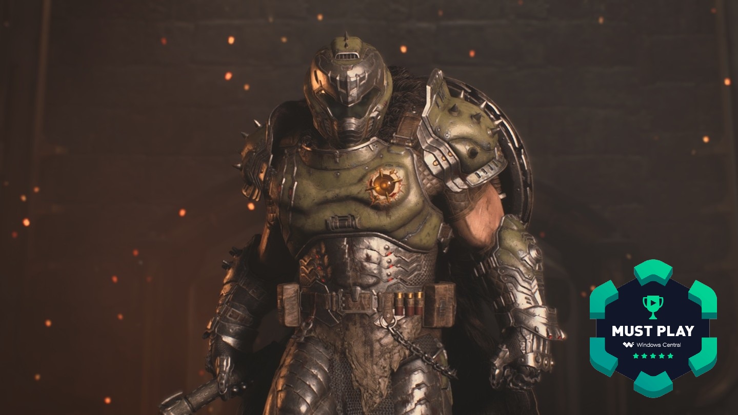 A cinematic hero shot of the Slayer in DOOM: The Dark Ages with &quot;Must Play&quot; award badge from Windows Central