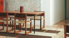 coil vase on steel-frame table set with wooden chairs from Collagerie and Zara Home collection