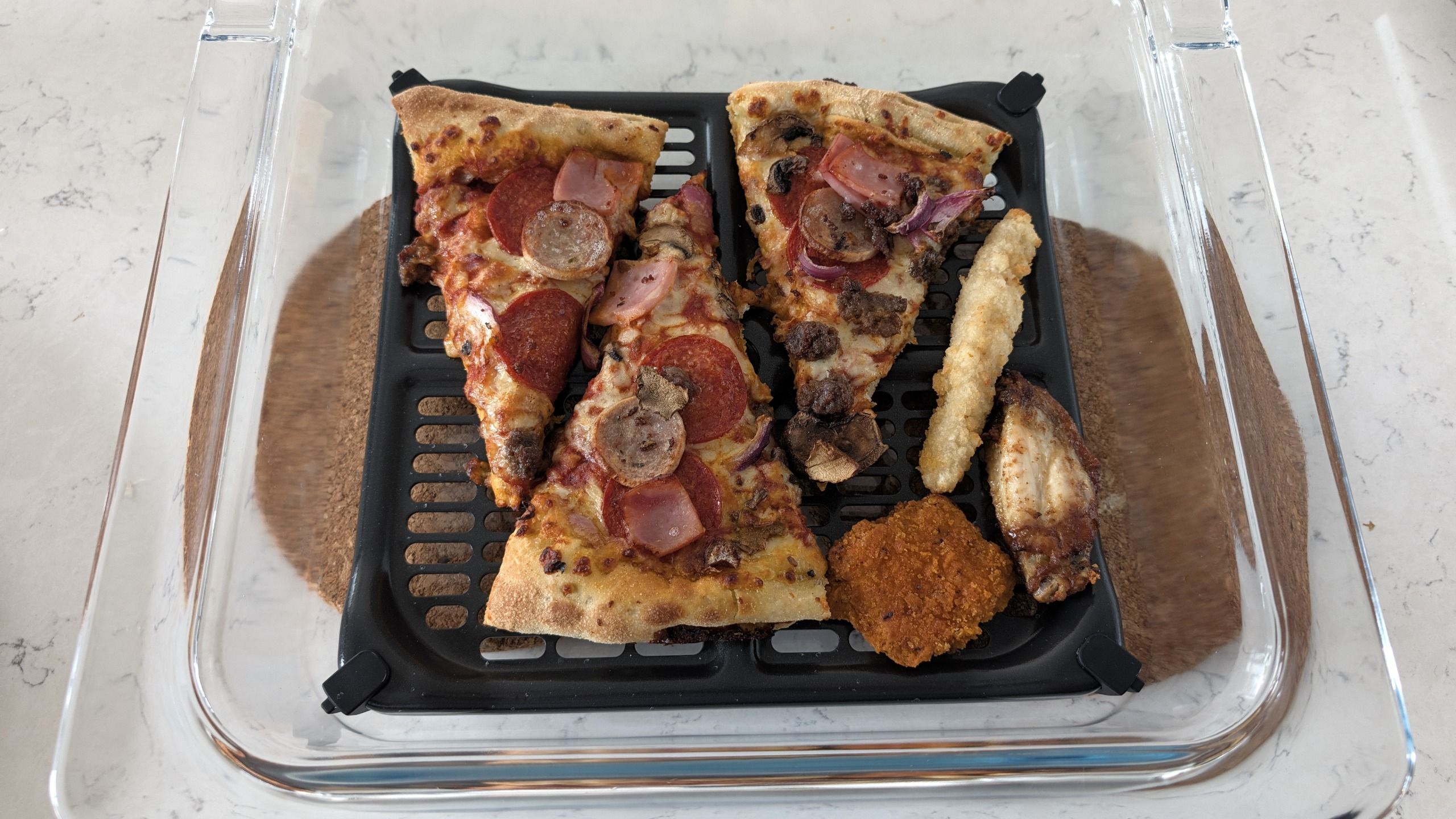 Pizza and snacks reheated using Ninja Crispi Microwave
