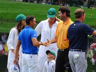 Smiles all around on the ninth green