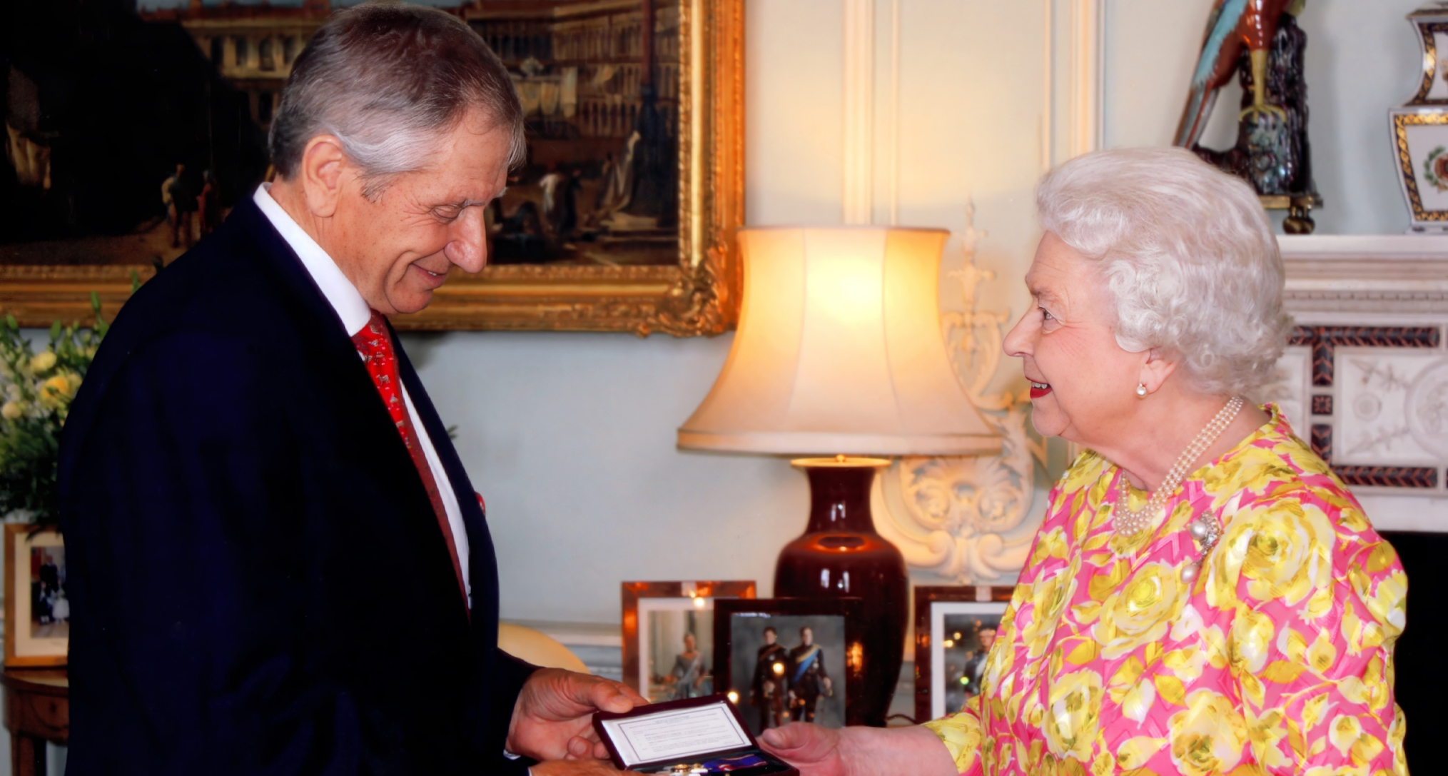 Monty Roberts receiving an MVO from Queen Elizabeth