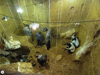 Researchers excavate the Tam Pa Ling cave.