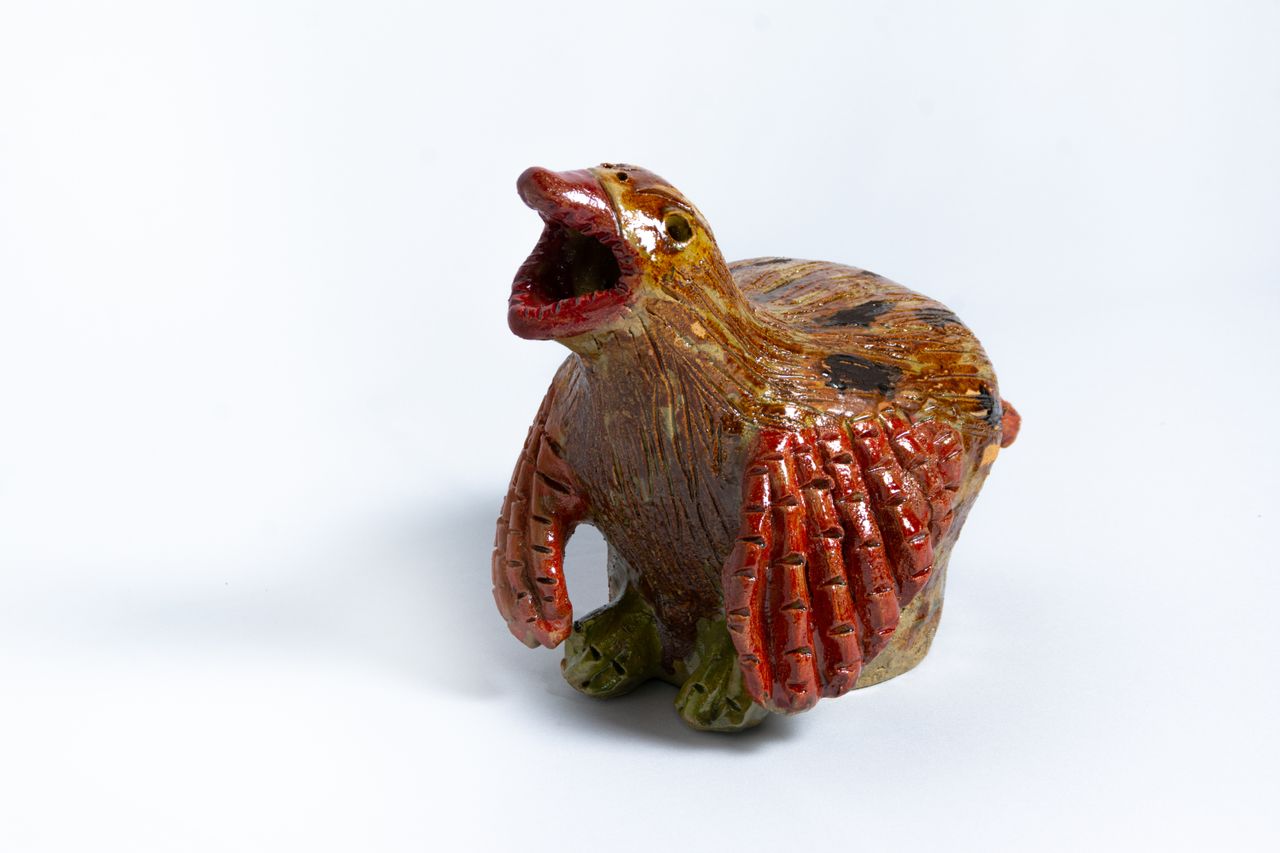 Colourful animal head ceramic vessels