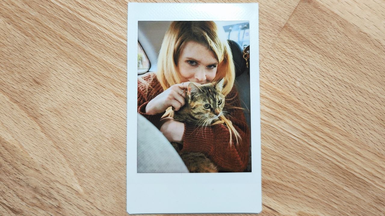 Instant photos on a wooden table