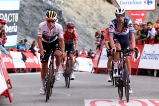 COL DU TOURMALET FRANCE SEPTEMBER 08 LR Remco Evenepoel of Belgium White best young jersey and Mattia Cattaneo of Italy and Team Soudal Quick Step cross the finish line during the 78th Tour of Spain 2023 a 1347km stage from Formigal Huesca la Magia to Col du Tourmalet 2115m UCIWT on September 08 2023 in Col du Tourmalet France Photo by Alexander HassensteinGetty Images
