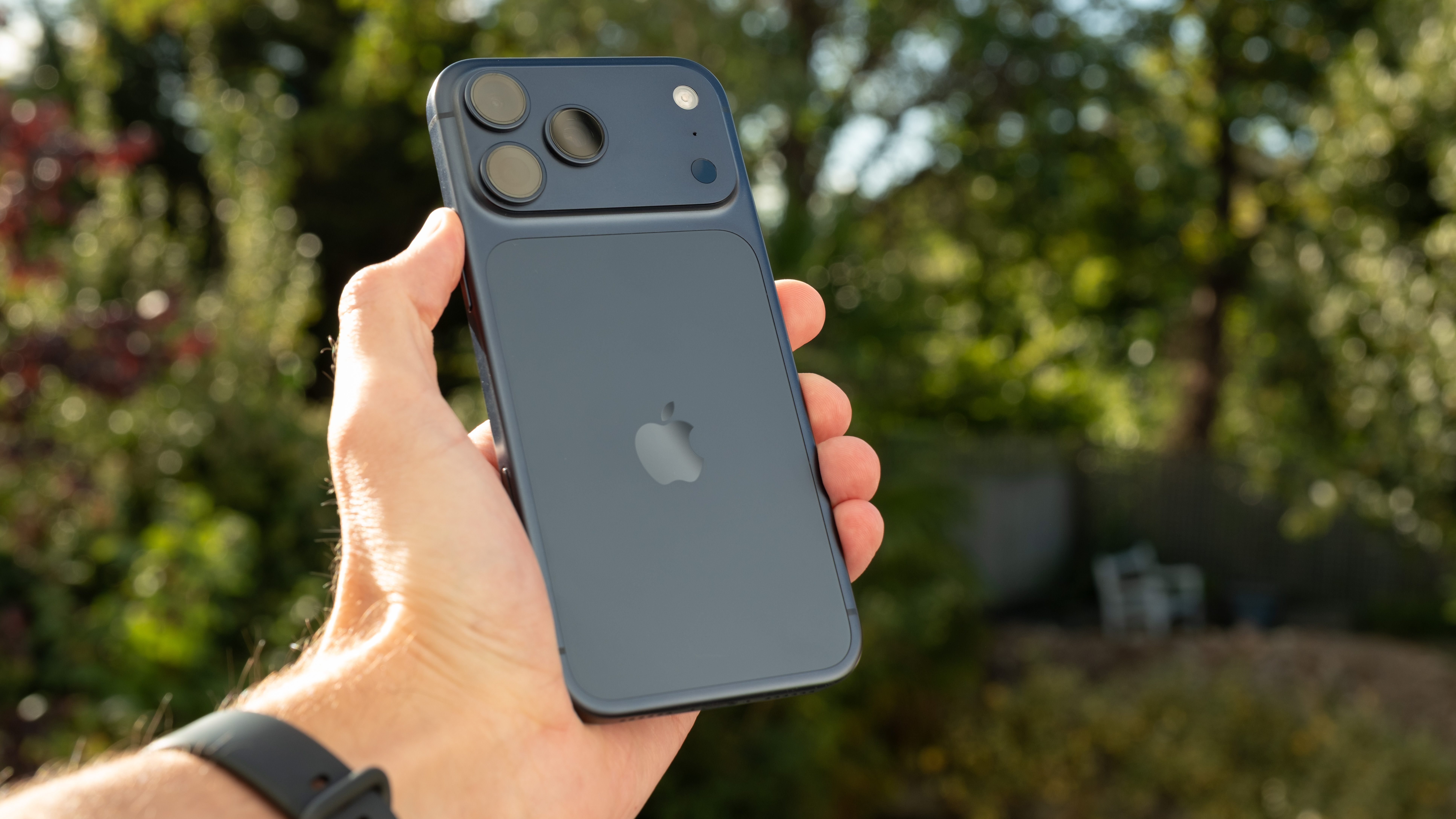 Apple iPhone 17 Pro Max in blue held in a hand