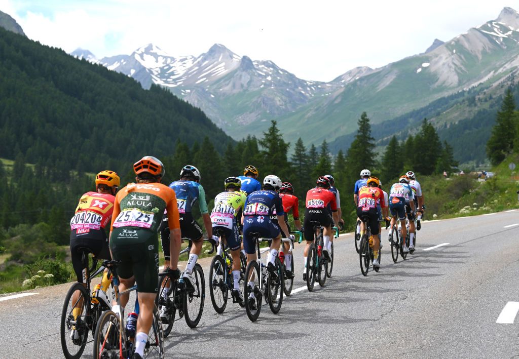 VALLOIRE FRANCE JULY 02 LR Tobias Halland Johannessen of Norway and Team UnoX Mobility Chris JuulJensen of Denmark and Team Jayco AlUla Bruno Armirail of France and Decathlon AG2R La Mondiale Team Kobe Goossens of Belgium and Team Intermarche Wanty David Gaudu of France and Team Groupama FDJ Raul Garcia Pierna of Spain and Team Arkea BB Hotels and a general view of the breakaway approaching to the Col du Galibier 2642m during the 111th Tour de France 2024 Stage 4 a 1394km stage from Pinerolo to Valloire UCIWT on July 02 2024 in Valloire France Photo by Dario BelingheriGetty Images