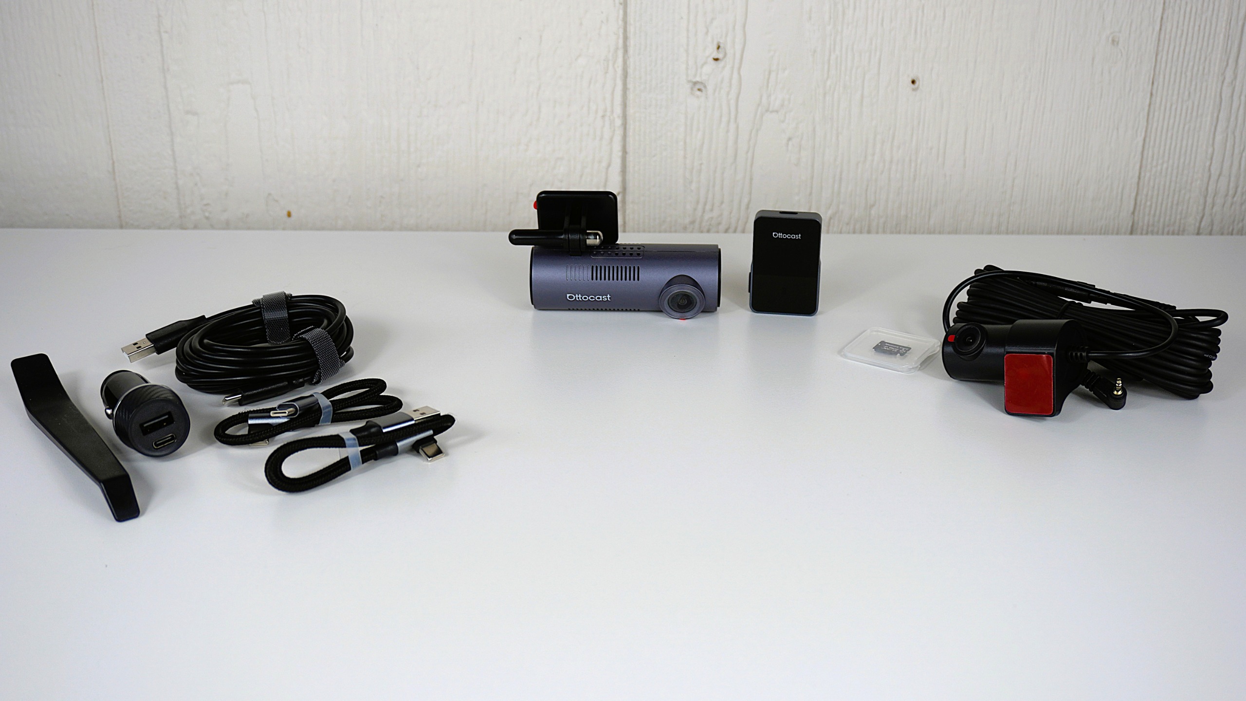 The Ottocast OttoSafe Cam dash cam unboxed on a table
