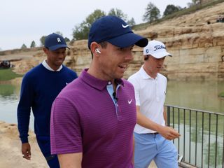 Woods, McIlroy and Woods walk