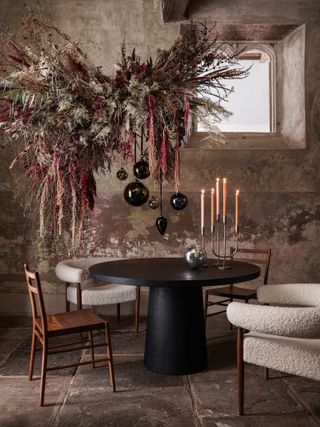 Suspended floral arrangement in a dining room decorated for Christmas
